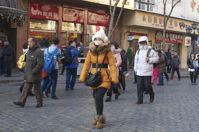 A woman wearing a face mask to protect herself from sickness